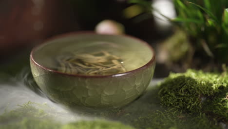 elegant tea ceremony set against a serene mountain backdrop creates a tranquil, zen-like atmosphere with a beautiful mountain backdrop creating a tranquil scene