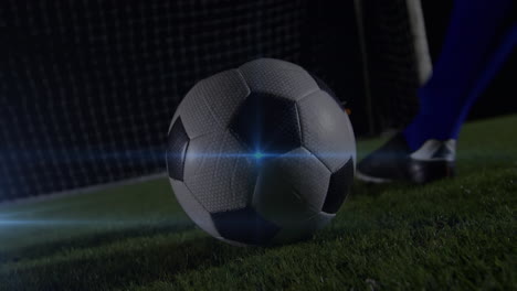 animación del punto de luz azul de la sección baja del jugador de fútbol masculino pateando la pelota