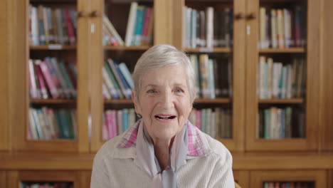 portrait of happy elderly caucasian woman in library laughing cheerful enjoying relaxed retirement