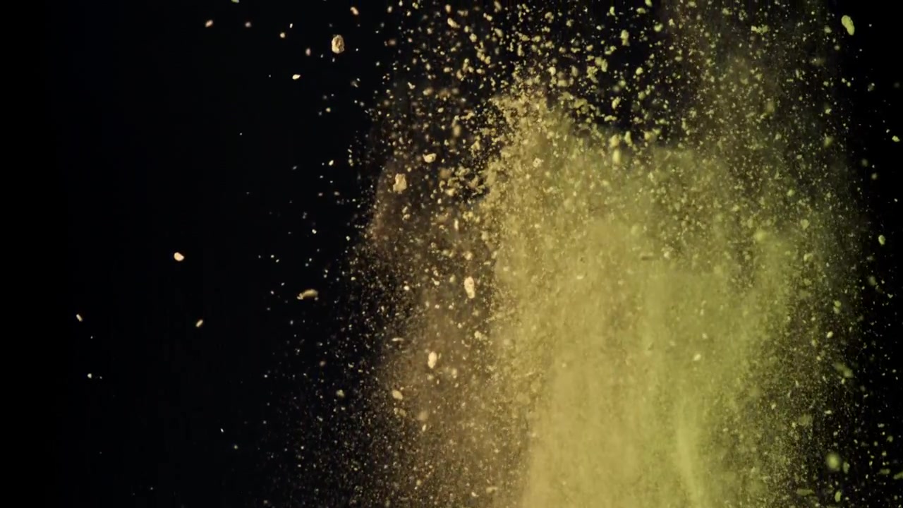 Levende gulgrønt pulver eksploderer i slowmotion