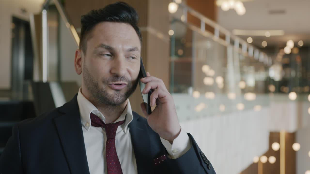 Businessman on a phone call in a hotel lobby