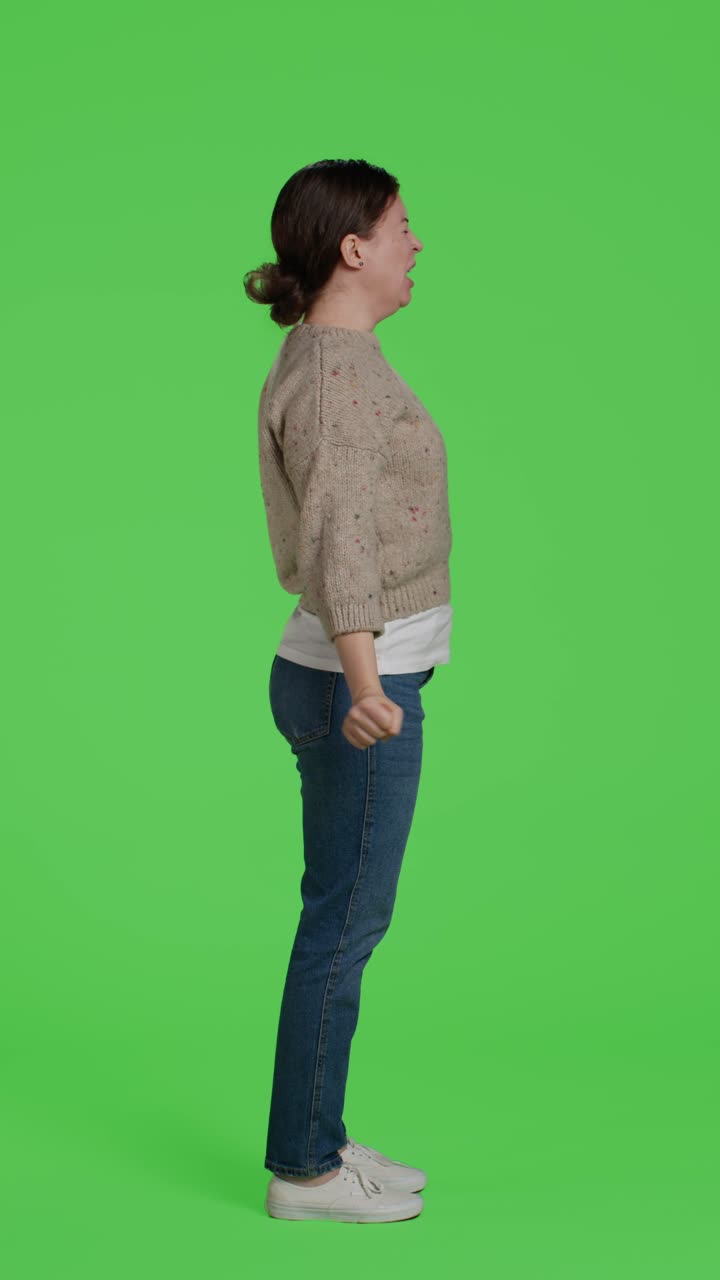 Vertical video: Profile of exhausted person yawning in front of camera
