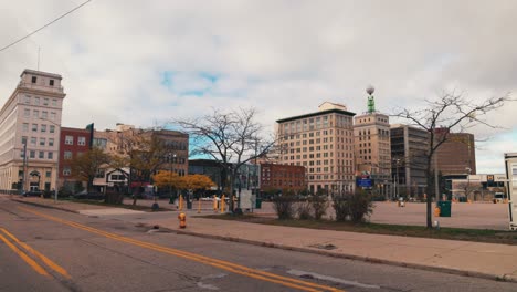 flint, michigan downtown buildings gimbal shot walking on the street