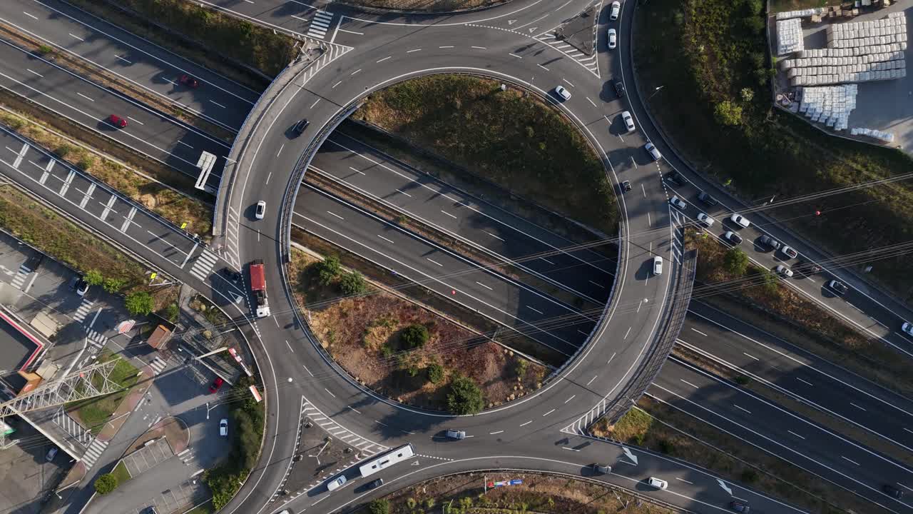 Highway exit rush hour on roundabout with sun setting