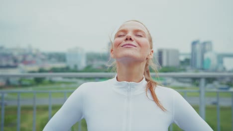 a serene woman enjoying fresh air in the city