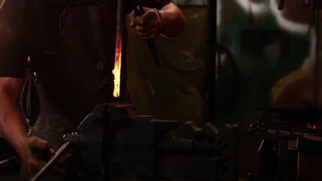 Blacksmith-working-at-workshop