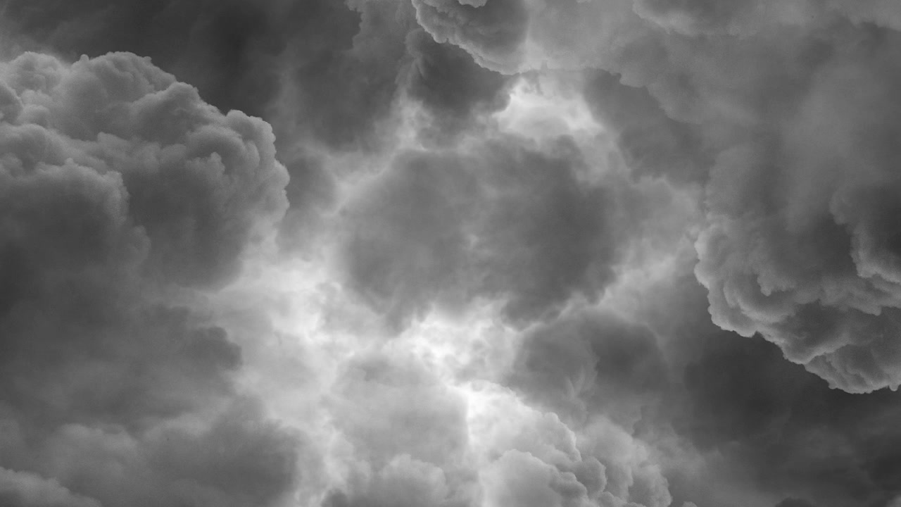 gray dark clouds in the sky and lightning strikes