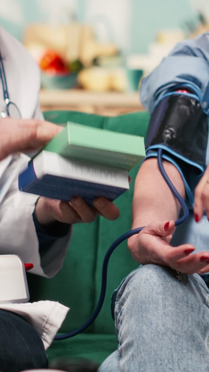 Vertical Video Aged senior patient, blood pressure device, doctor home visit