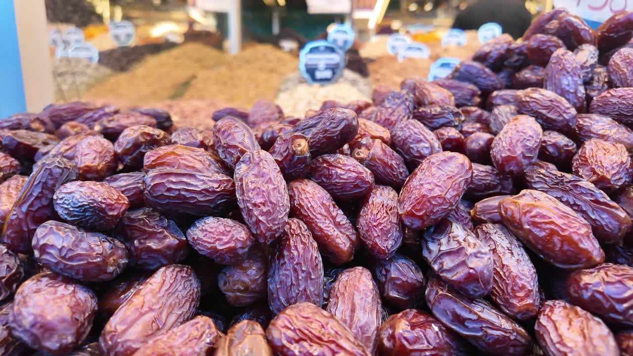 A close-up of dates for sale at a market stall
