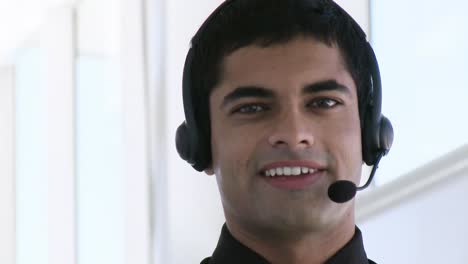 hispanic businessman with headphones on