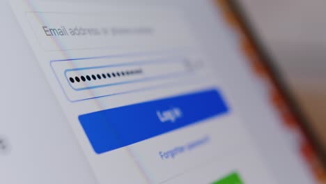 a close-up of a digital login screen with email and password fields