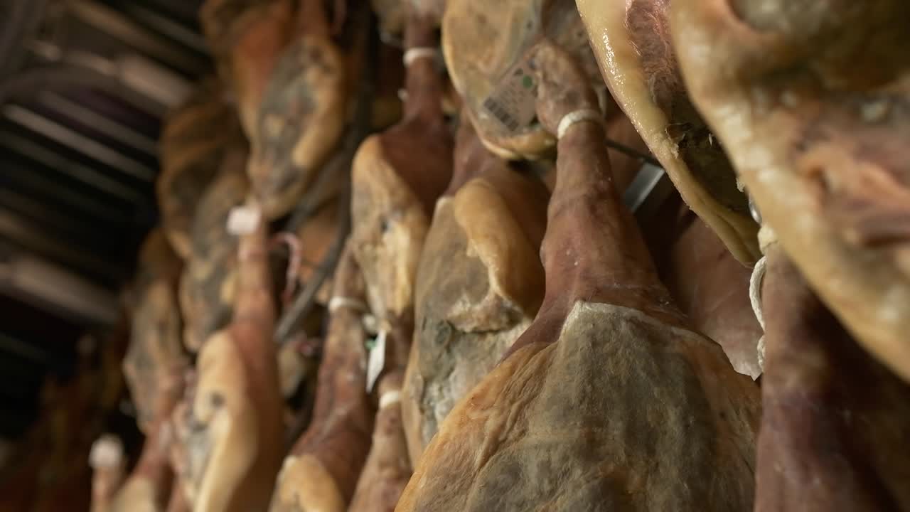 Jamon serrano pig legs factory hanging in a industry. Iberian ham elaboration process