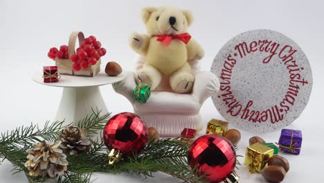 teddy bear and  christmas decorations, white background,
children's decorative composition