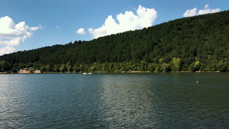 clip of the pancharevo lake with some sailboats sailing, during a sunny day