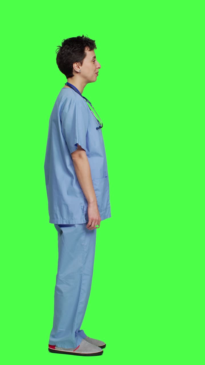 Profile Joyful medical assistant greeting patients with a smile and waving