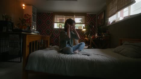 woman listening to music in a cozy home studio