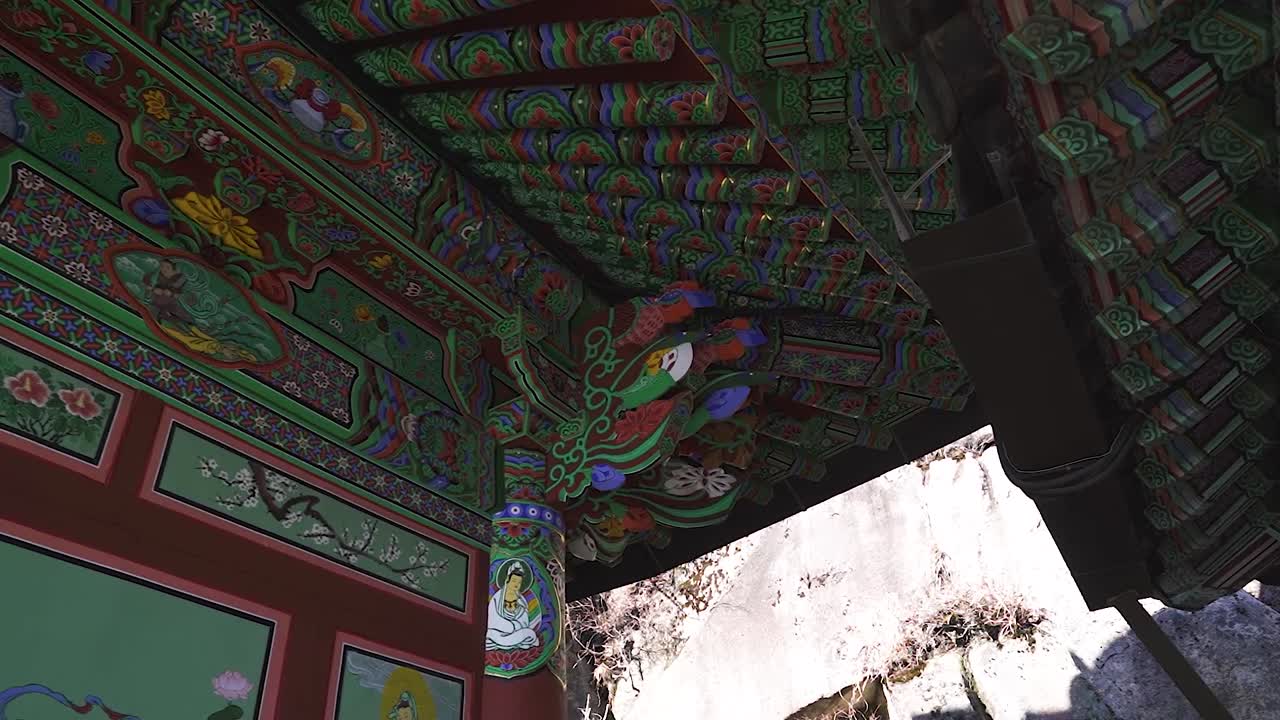 A panning shot of a roof of buddhist temple in South Korea during winter (shoot info: Cin2, 1080p, 23.97fps slowmotion from 59.94fps)