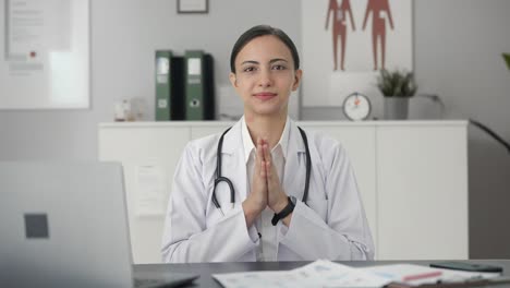 Happy-Indian-female-doctor-doing-Namaste