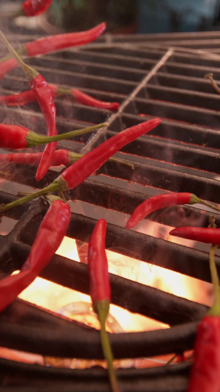 Red Chilies Cooking on a Grill