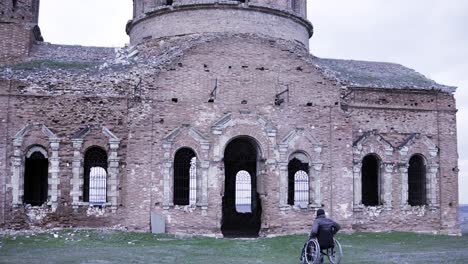 disabled person at a ruined church