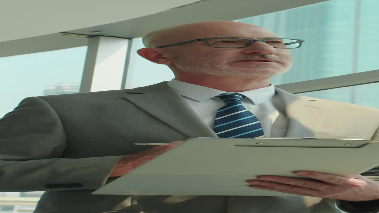 Mature Lawyer Talking about Terms of Contract