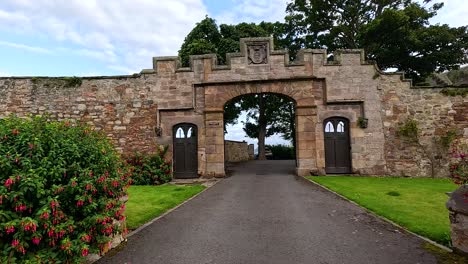 stone archway with greenery and distant view