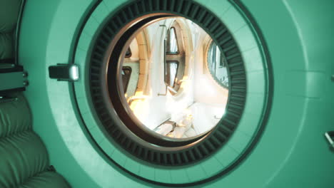 interior view of a space station module with circular window and lighting