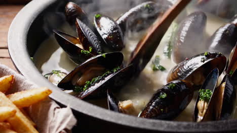 delicious mussels in creamy sauce with french fries