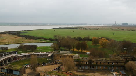 Flying-above-Coalhouse-Fort-revealing-the-River-Thames-and-Tilbury-docks-in-background