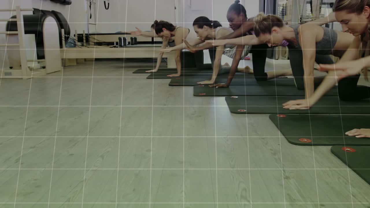 Seven women kneeling on exercise mats, green chart appearing and cueing syncing reaches for balance