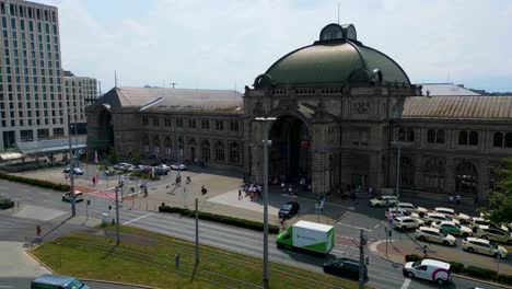 4k aerial drone video of the taxi stand in front of the hauptbahnhof train station in downtown nürnberg, germany