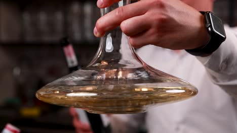 bartender pouring wine from decanter