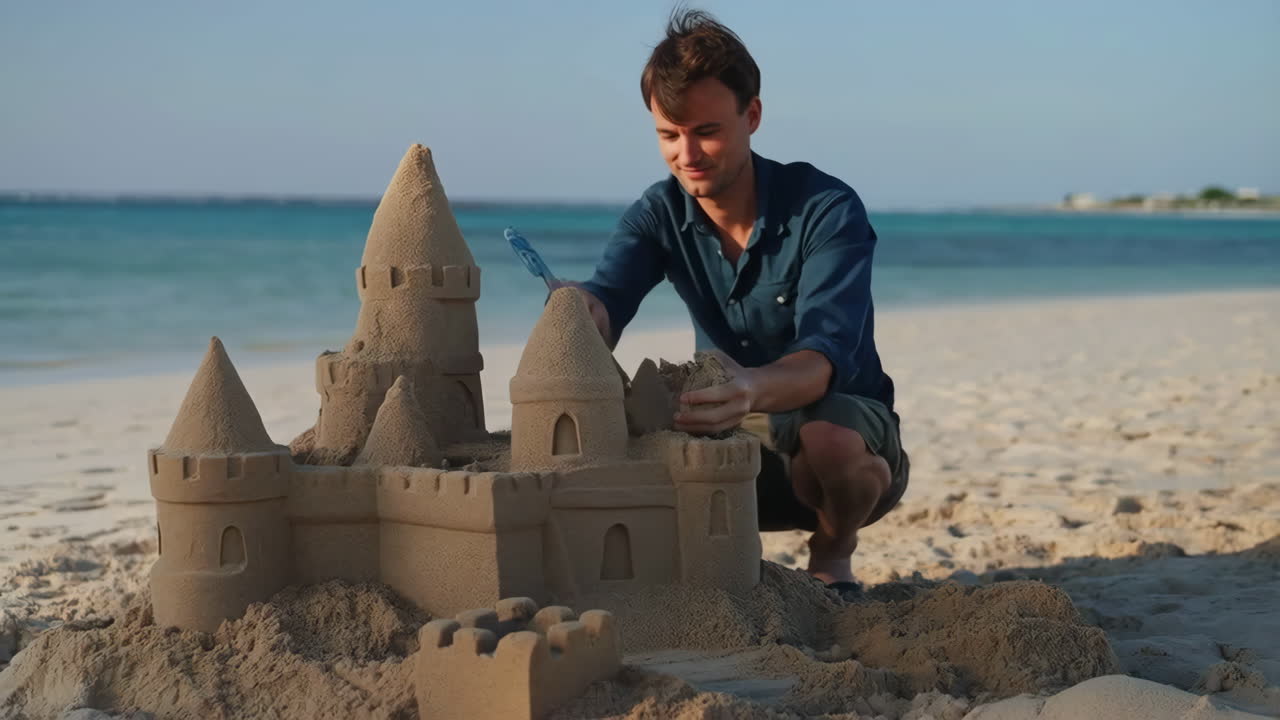 Man building a sandcastle on a beach