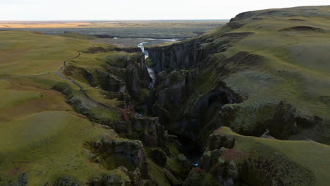 deep gorge of fjadrargljufur canyon at sunset in south iceland