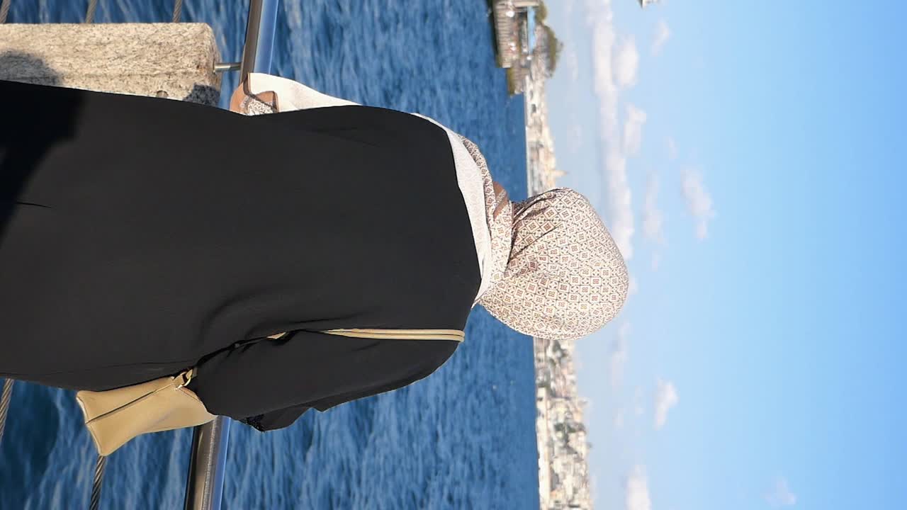 Woman in Hijab by the Sea