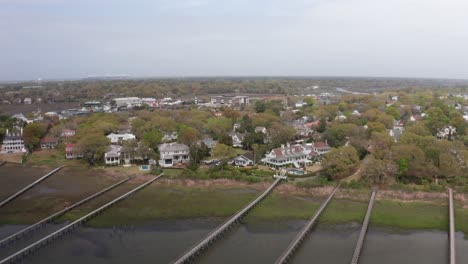 aerial low shot flying over fishing docks near historical old village mount pleasant, south carolina