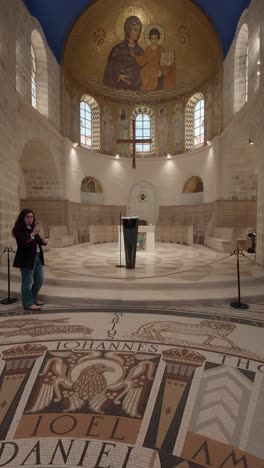 interior of a beautiful chapel with mosaic flooring and artwork