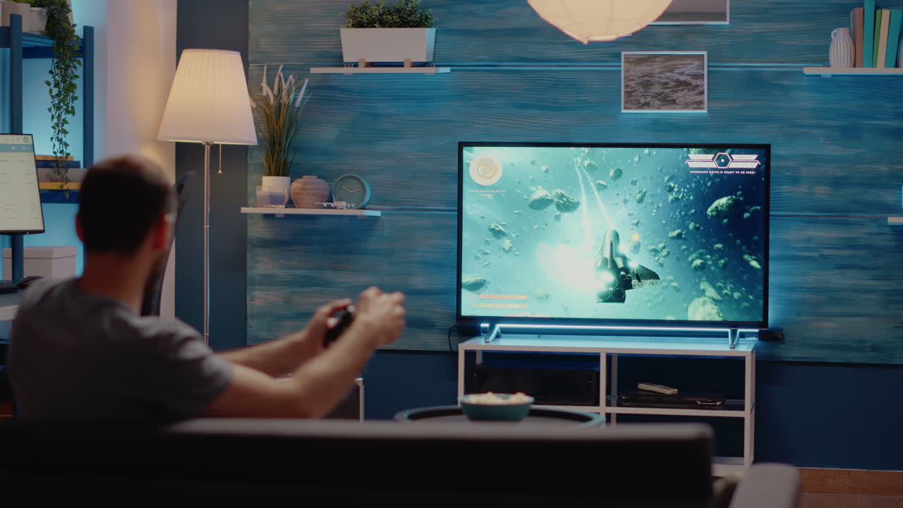 Caucasian man playing video games on tv console
