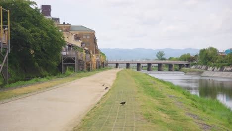 kyoto kamogawa and gion shijo establishing shot, pan on overcast day japan