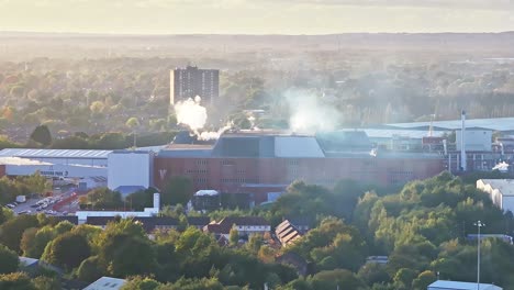 steam is rising above the offices in old trafford, manchester