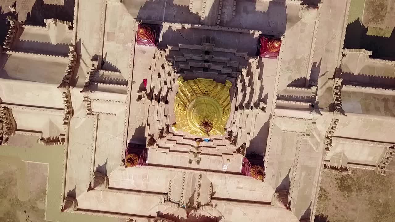 A breathtaking top-down view of the White Temple at Ananda Temple, Bagan, Myanmar, highlighting the gleaming golden Sertok and intricate architectural design in a serene spiritual setting.