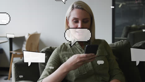 animation of speech bubbles over caucasian businesswoman using smartphone