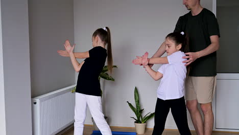 man teaching girls in class