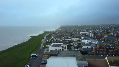 drone shot houses on cliff edge in brighton, england