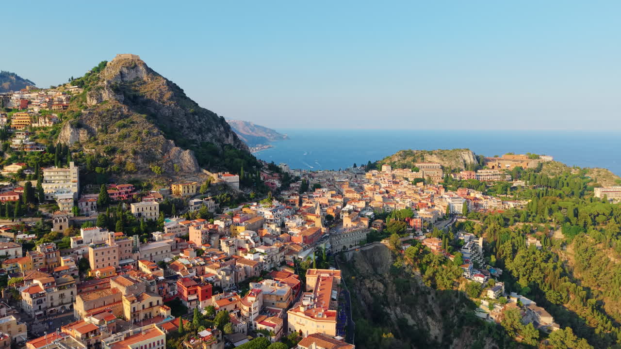 World wide famous Italian town of Taormina at sunset. Drone view