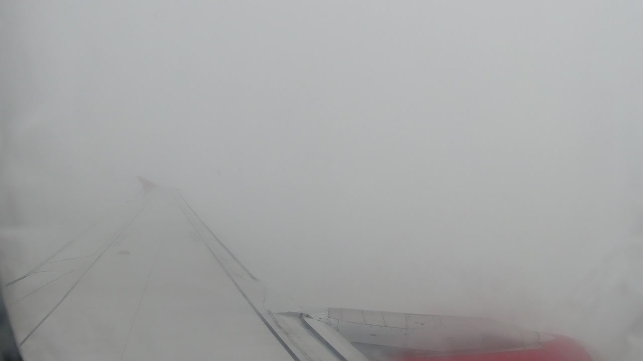 Flying Through Stormy Weather: Airplane Window View