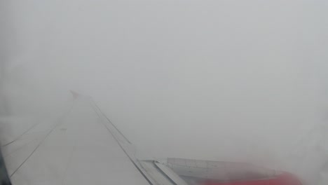 flying through stormy weather: airplane window view
