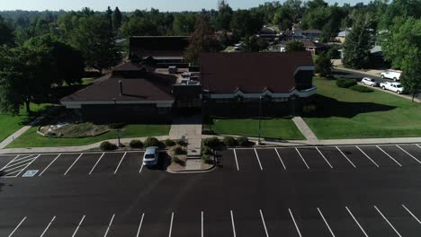 Suburban-Christian-church-flyover-with-an-empty-parking-lot-summer-2022