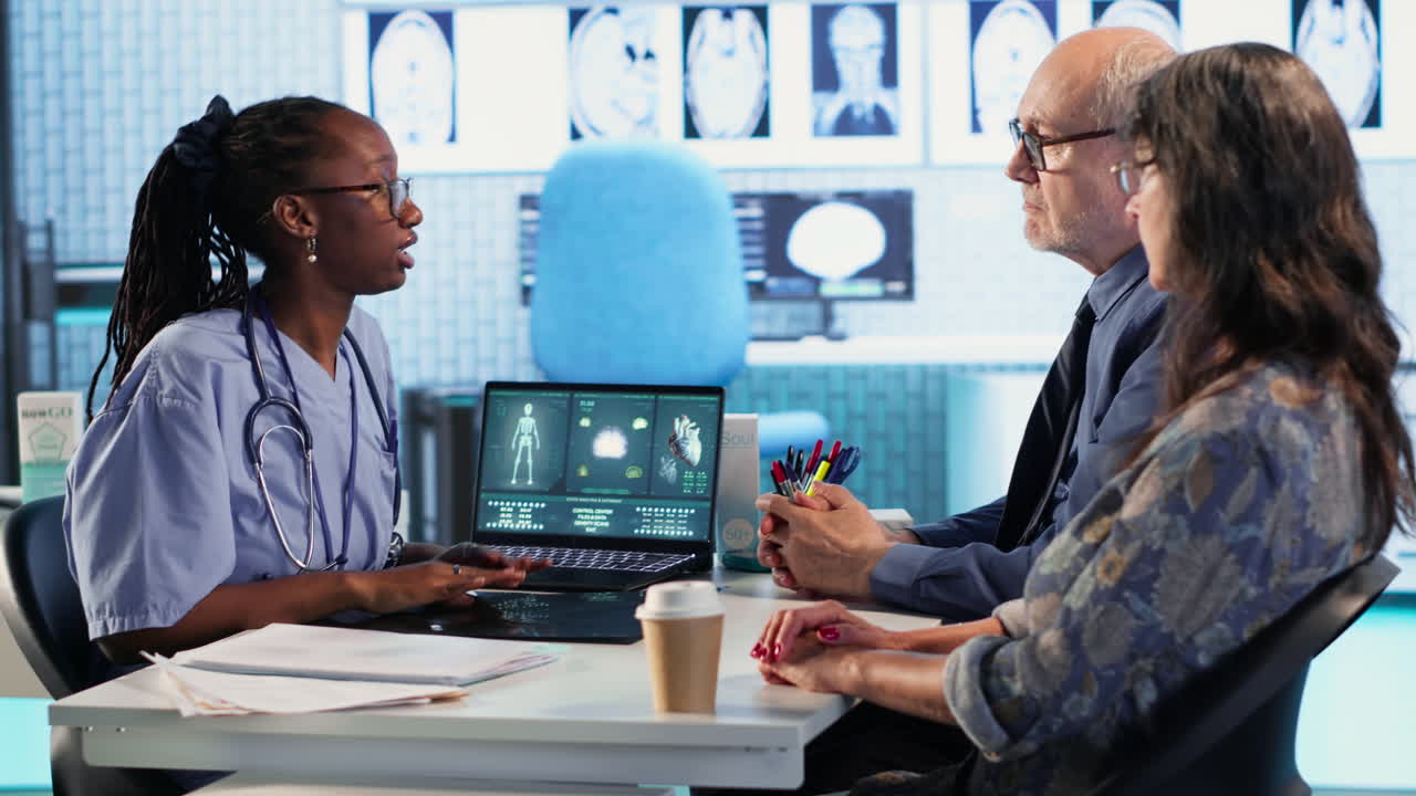 Vertical Video Nurse and patients reviewing diagnostic results in medical cabinet
