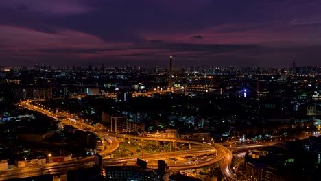 rama 8 bridge and highway, skyscrapers in bangkok city, thailand. day to night time lapse